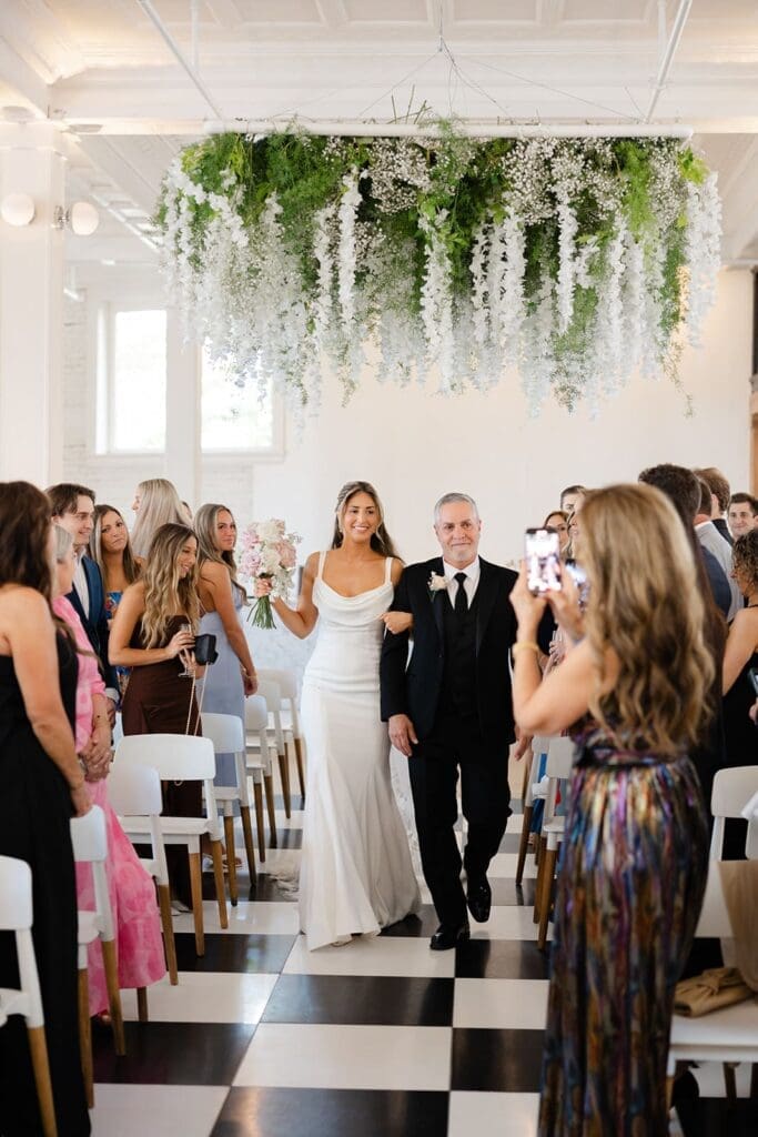 bride walking down the aisle with her father at her Gordon Green wedding